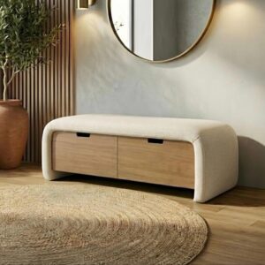 Modern upholstered storage bench with oak drawers in minimalist entryway, round mirror and jute rug, neutral Scandi decor.