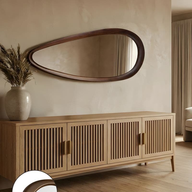 xfXi8oLX Mid-century modern oak slatted sideboard with organic teardrop wood mirror in a neutral living room decor