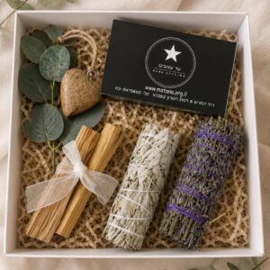 Smudging gift set with palo santo sticks, white sage and lavender bundles, eucalyptus and wooden heart decor.