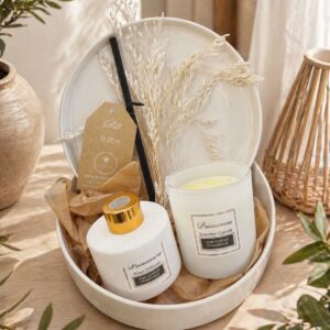 Pink pepper scented candle and reed diffuser gift set in white tray with dried grasses, cozy minimalist home decor
